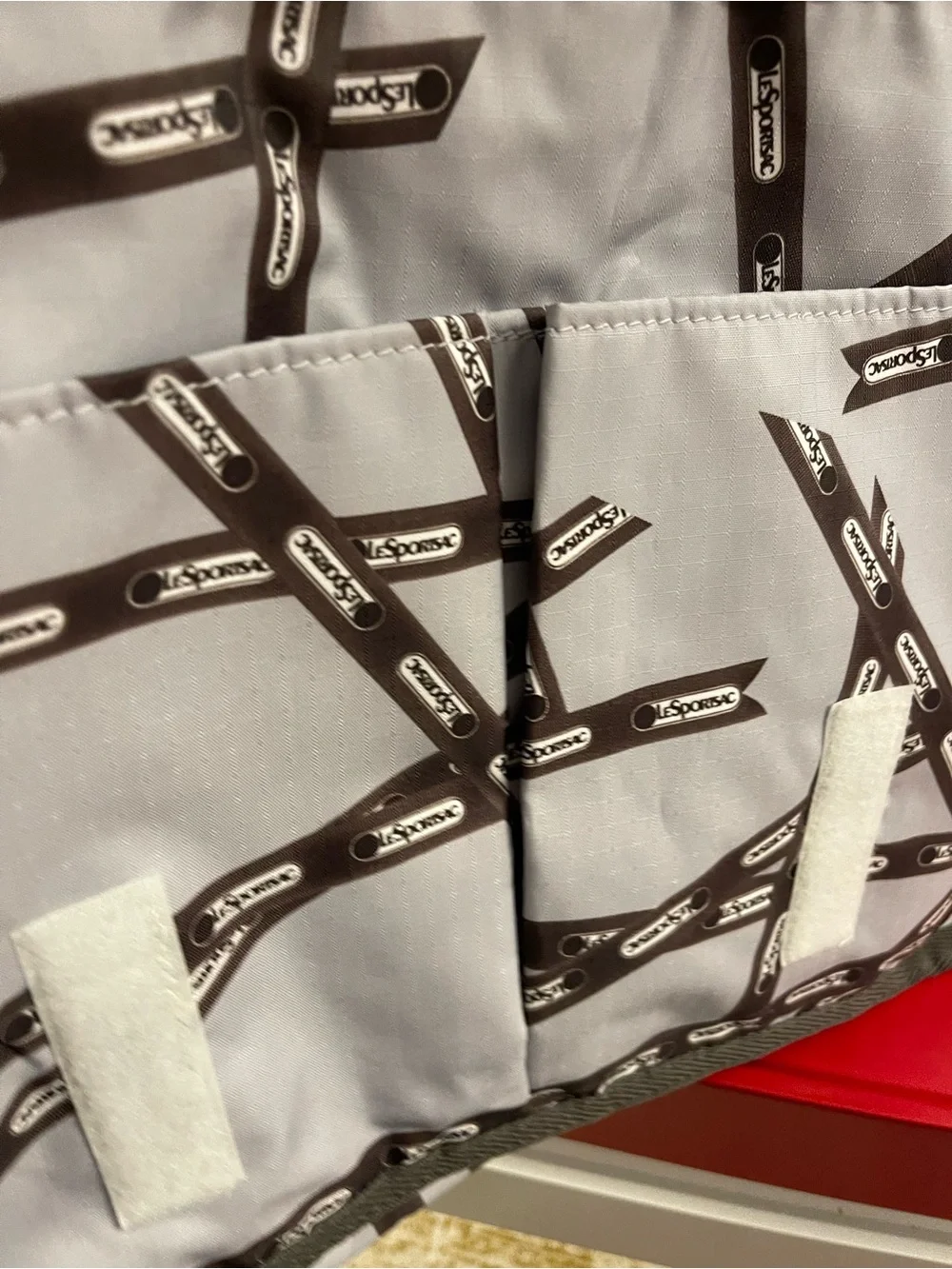 Lesportsac White and Brown Patterned Messenger Bag